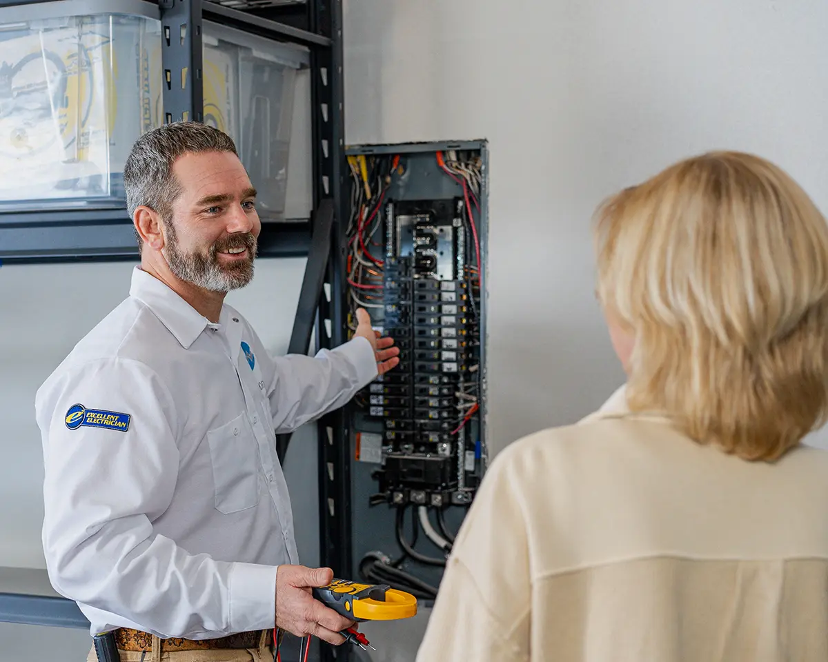 WIREONE Electrical working in a home — trusted electricians serving Iowa, Illinois, and Wisconsin.